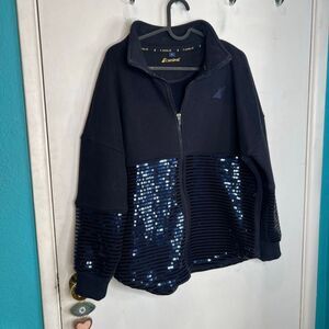 zip-up jacket featuring blue sequins that is official merchandise from Carnival